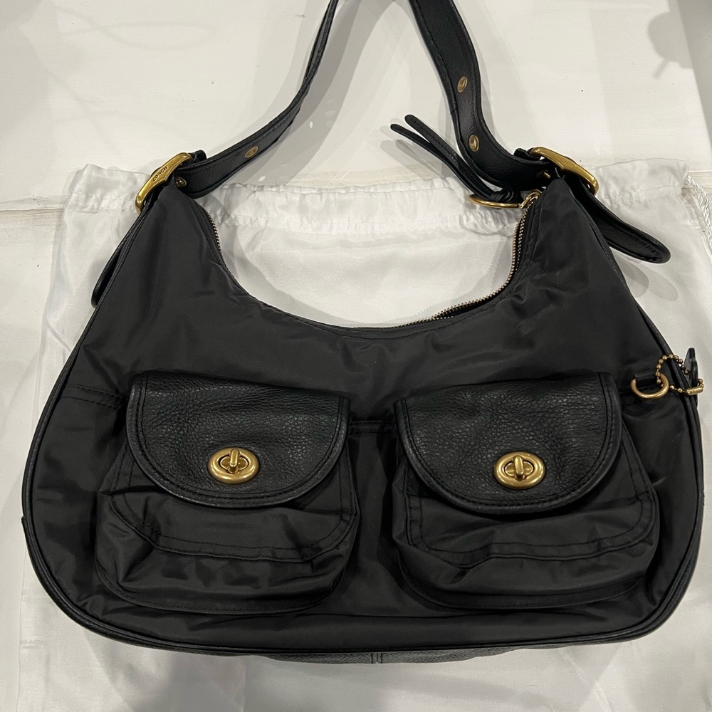 Coach small hobo. Used once. Perfect condition. Gold metal.